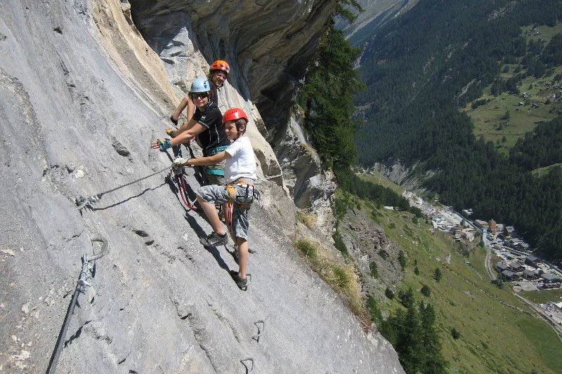 A family climbing a Via Ferrata